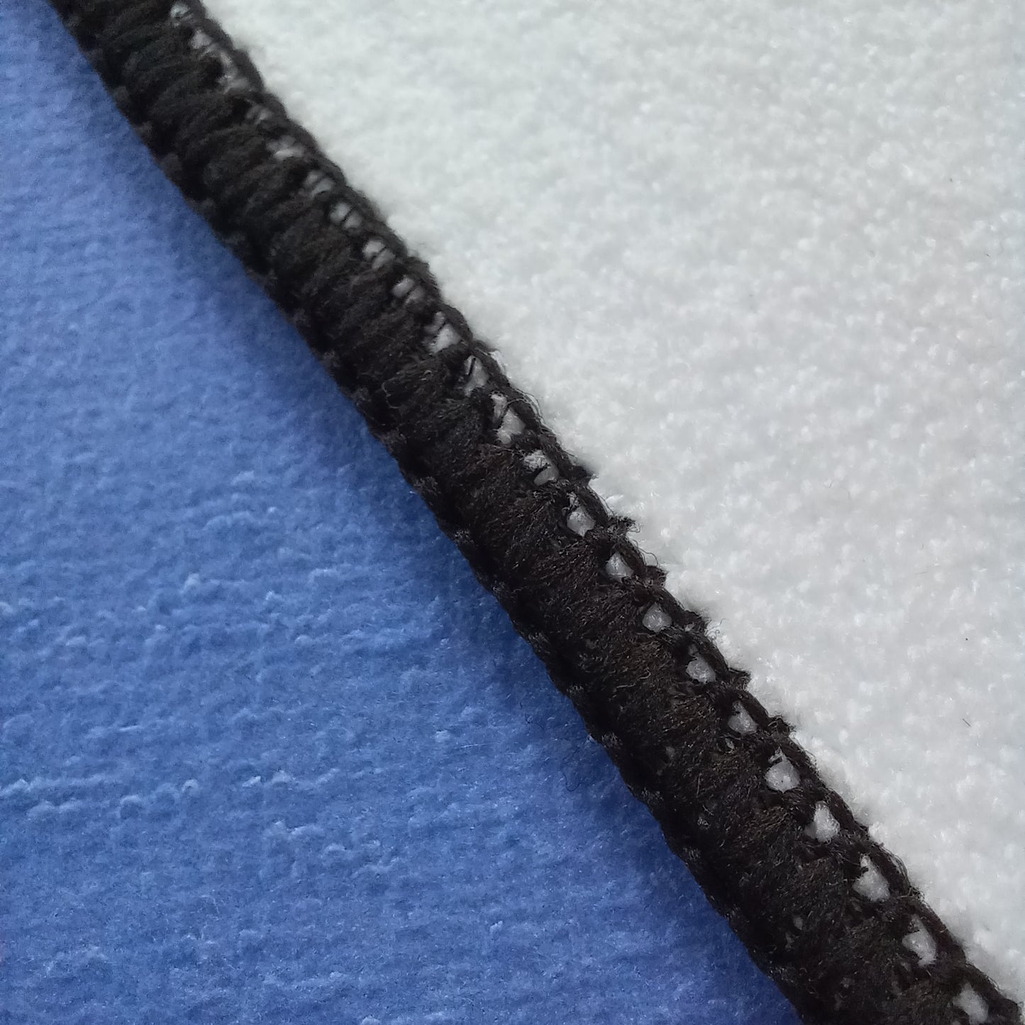 Texture of a Blue surfboard shaped beach towel 